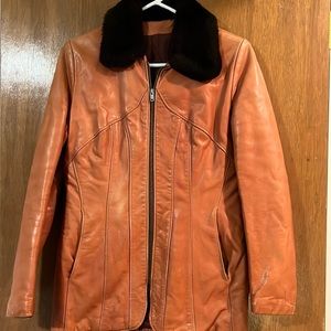 VINTAGE COAT. Brownish/orangeish leather with chocolate brown faux fur collar.